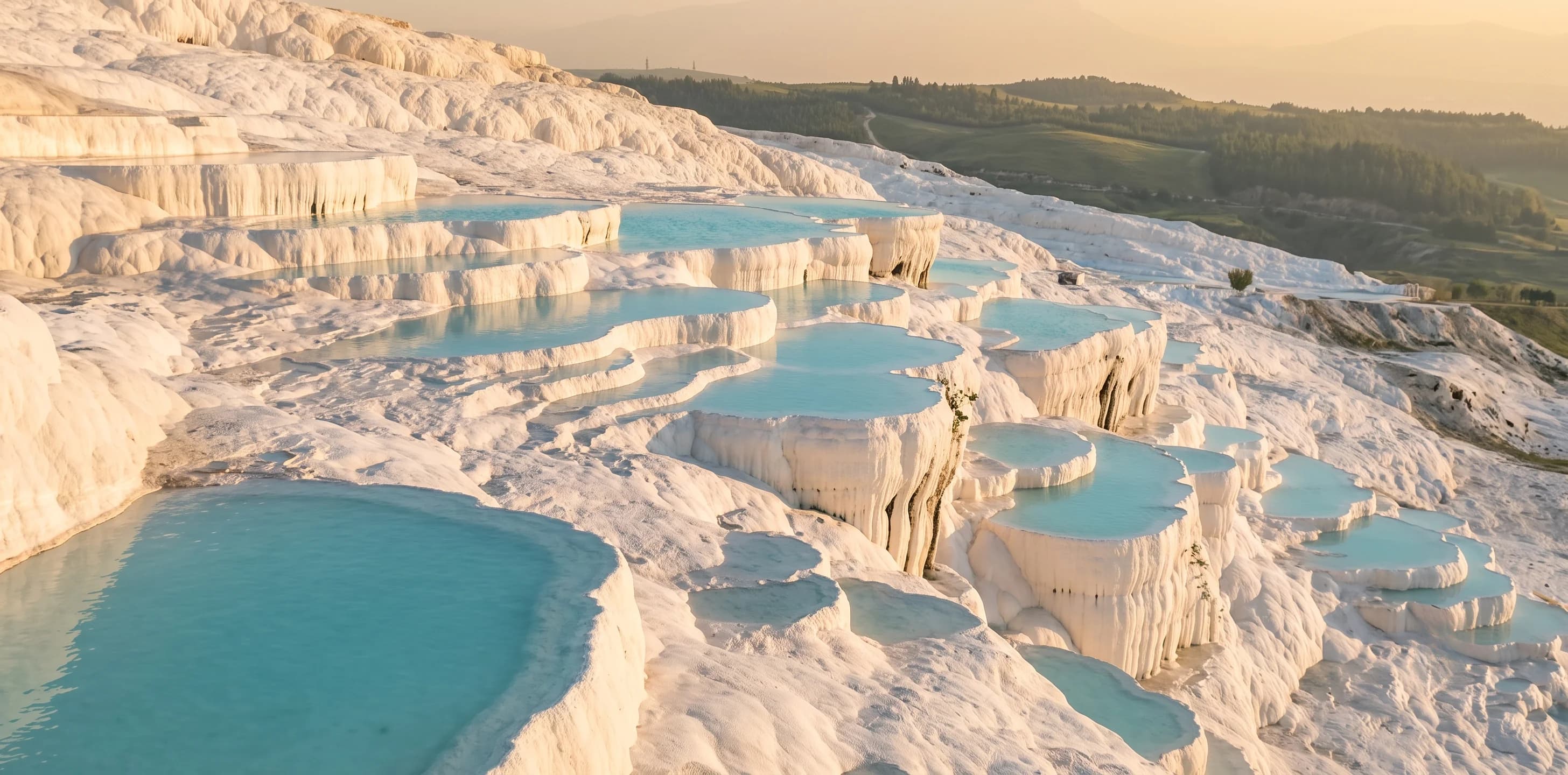 White travertine terraces and thermal pools of Pamukkale, Turkey