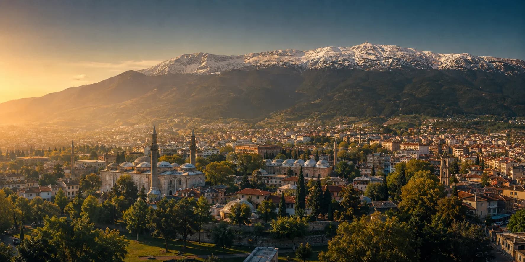 Bursa spread below the snow-capped slopes of Mount Uludağ, Ottoman domes and minarets among the rooftops